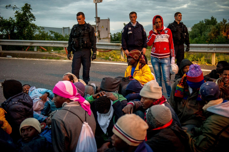 French gendarmes face migrants