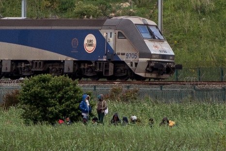 Calais migrants by Eurotunnel train