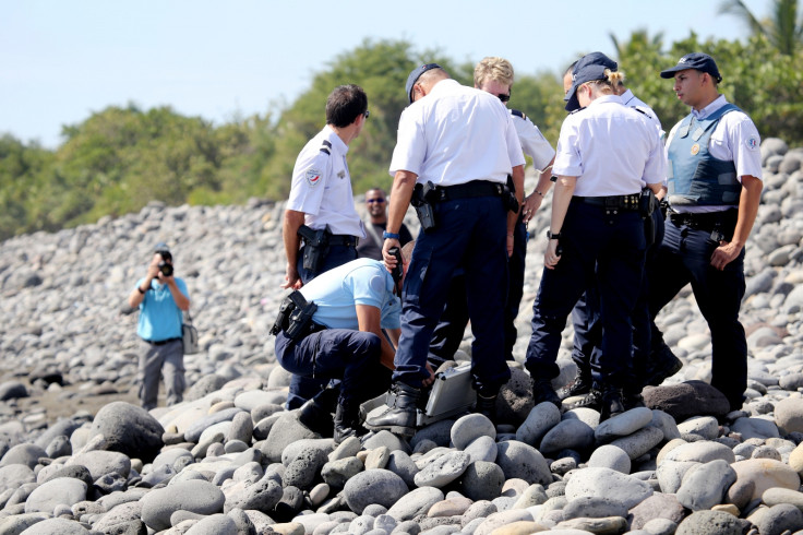 Police search for Flight 370 debris