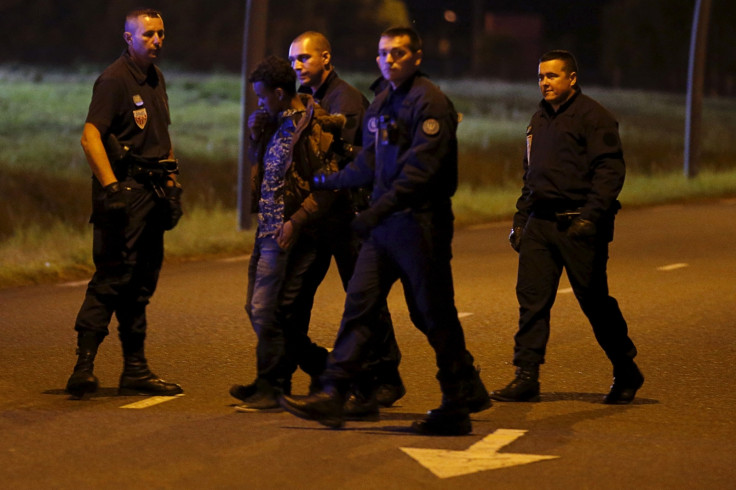 French riot police detain one migrant French riot police detain one migrant