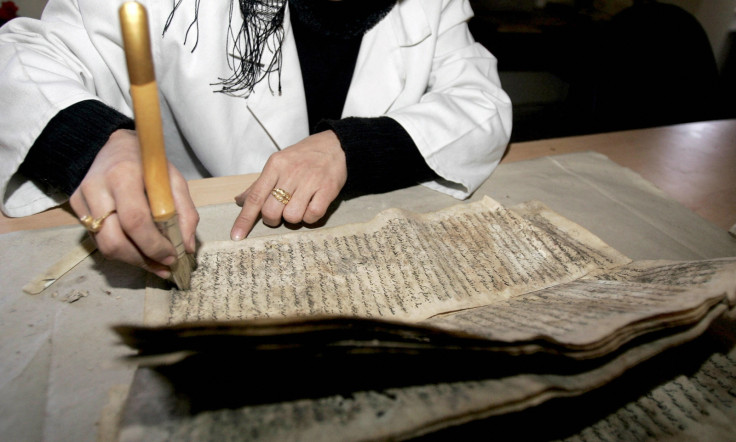 An expert restores a manuscript at BaghdadNationalLibrary