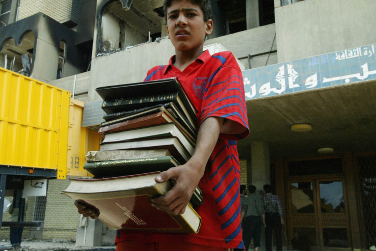 An Iraqi boy recovers books from Baghdad's