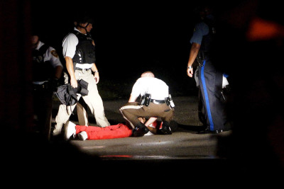Ferguson anniversary police shot man