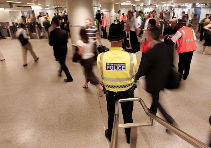 Police officers patrol the concourse