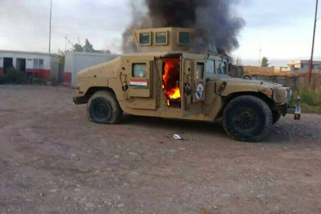 Military vehicle in Mosul in flames