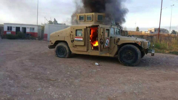 Military vehicle in Mosul in flames