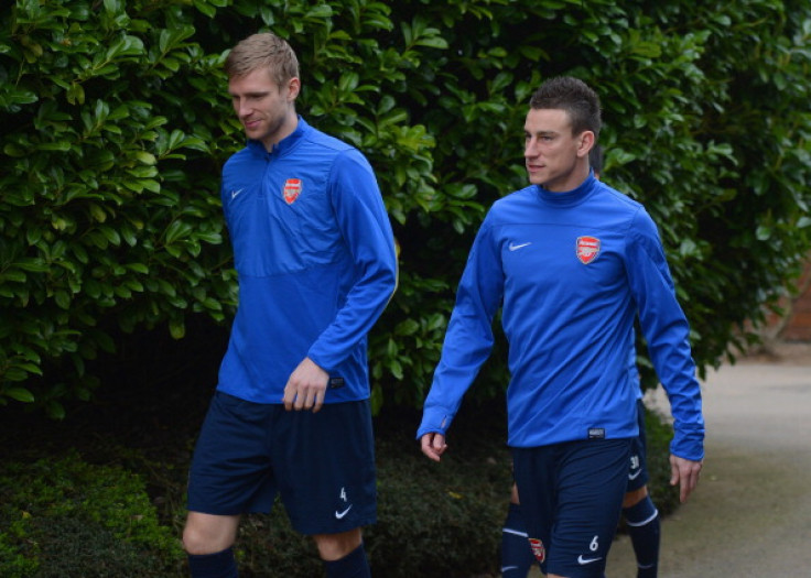 Per Mertesacker and Laurent Koscielny