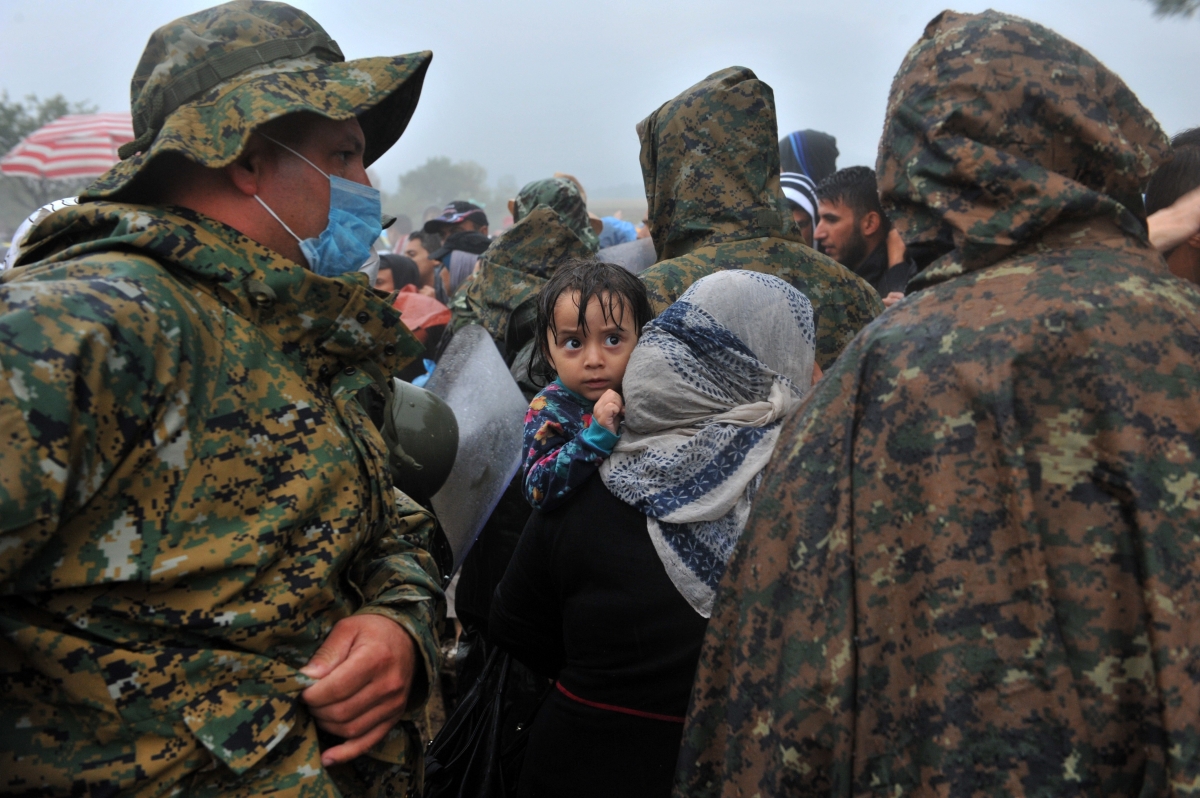 Refugees rain Greece Macedonia