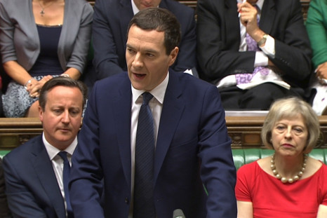 Chancellor of the Exchequer George Osborne (C), flanked by PM David Cameron (R) and Home Secretary Theresa May