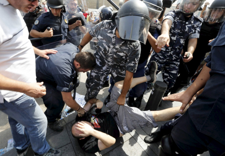 Riot police and protesters clash in Beirut