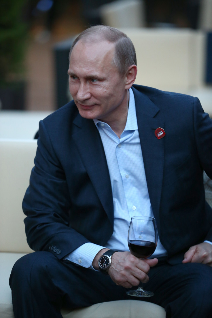 Putin enjoys a tipple during the Sochi