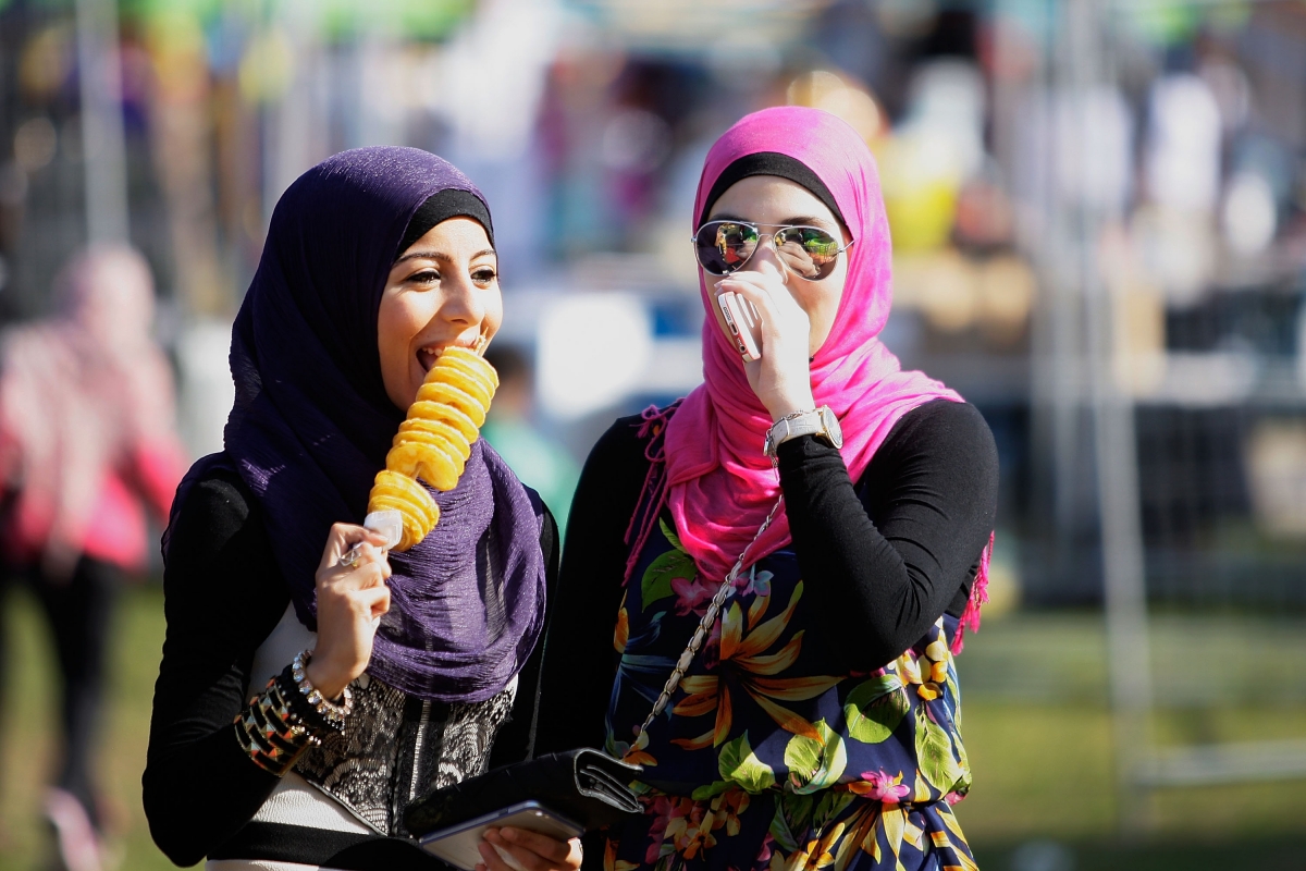 Young girls celebrate Eid al-Adha at a festival at Paul Keating Park in Syd...