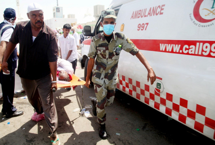 Red Crescent workers help a victim oftheMeccastampede