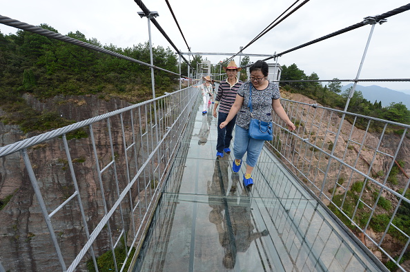 China opens glass-bottomed bridge in Shiniuzhai National Geological Park