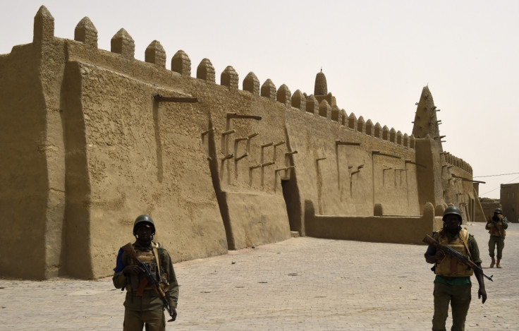 Malian soldiers patrol the ancient city of