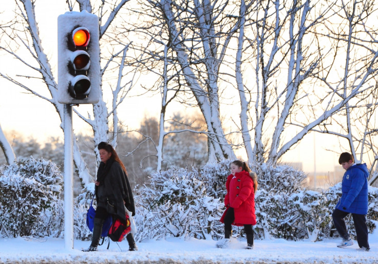 People walk in snow in the UK