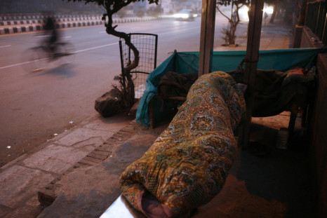 Homeless Indian man at bus stop