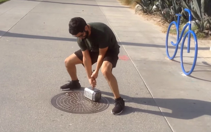 Man tries to lift Thor hammer replica