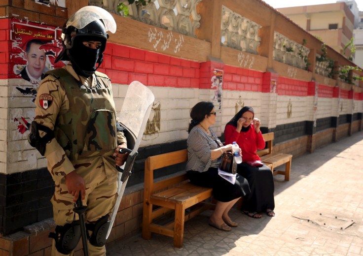 Security forces stand guard