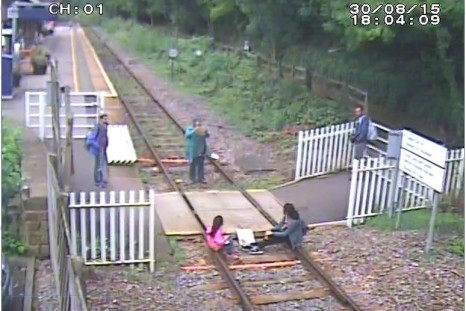 Matlock Bath - Children sit on rails while mother takes picture