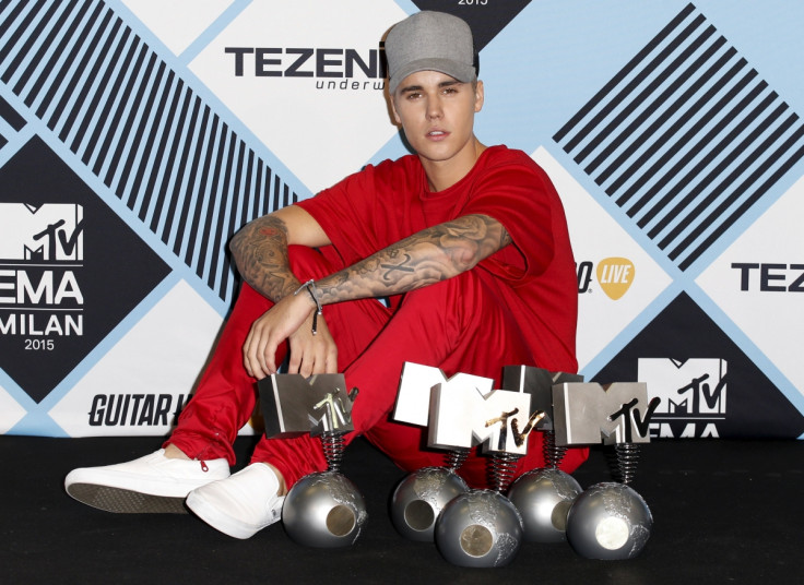 Justin Bieber with his awards