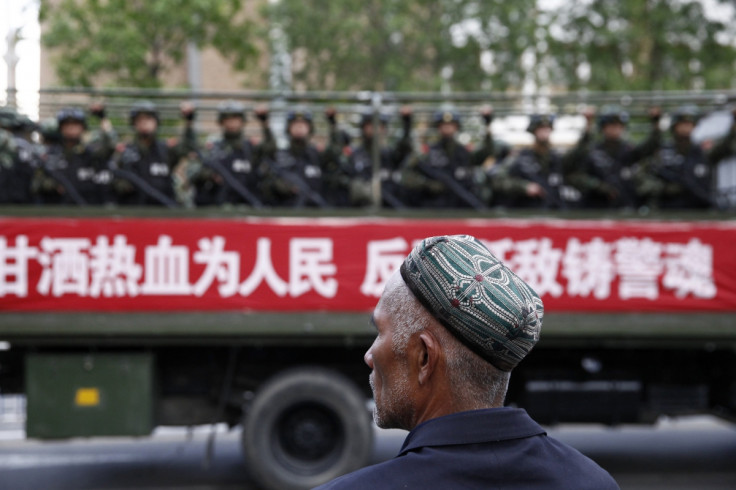 Uighur man looks on