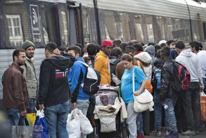 Immigrants board a train bound for Sweden
