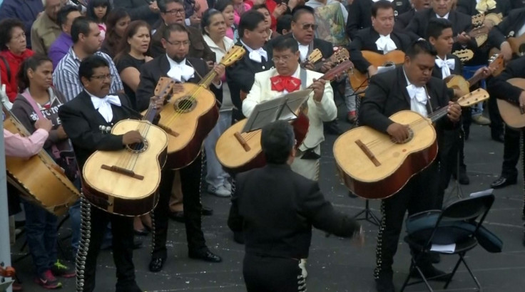 Mariachi musicians wearing their traditional garb