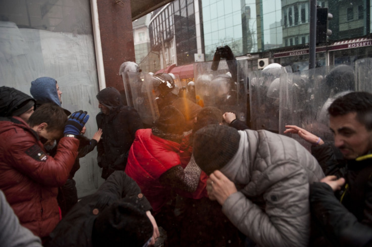 Kosovar policemen spray teargas
