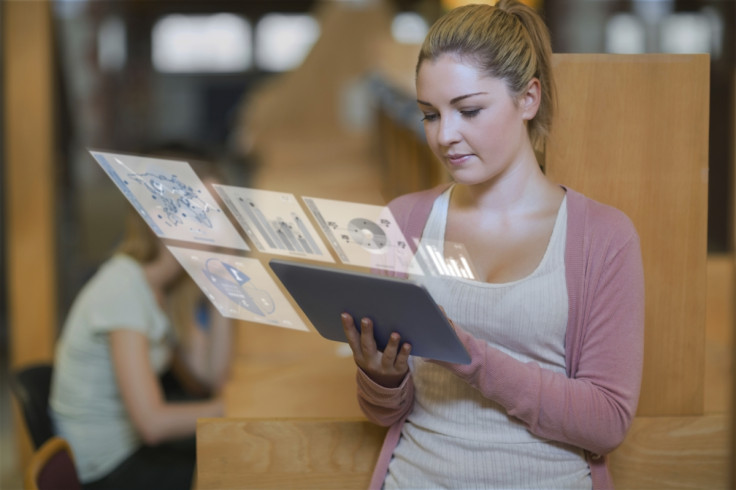 A girl looking at hologram projections 