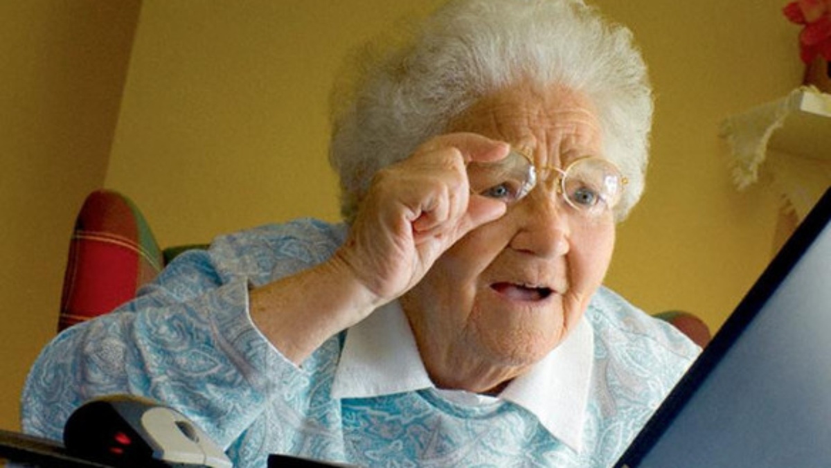 Grandma looks at TV screen