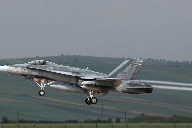 Canadian F-18 Hornet takes off from an