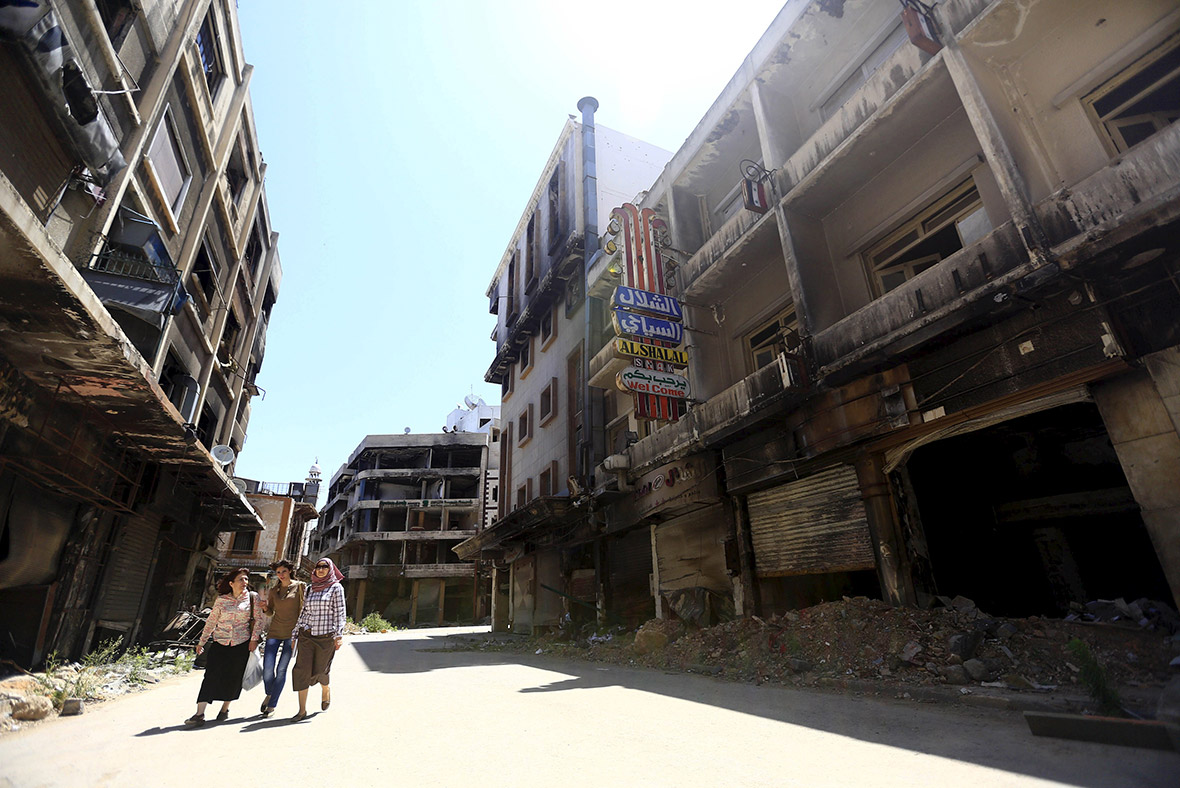 Syria: Shattered city of Homs returns to Assad control as fighters leave last rebel-held area