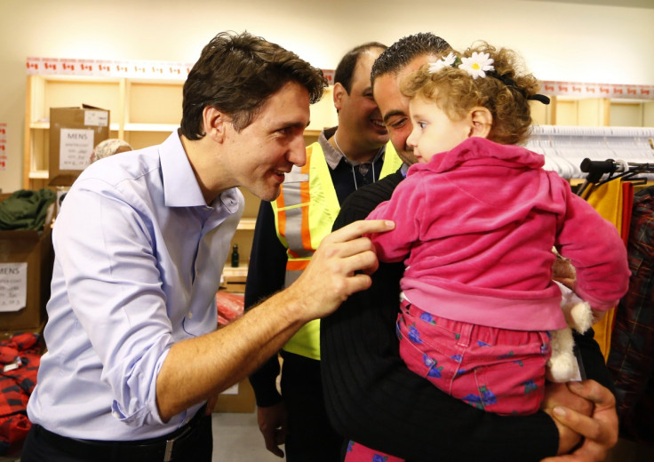 Syrian refugees are greeted by Justin Trudeau Syrian refugees are greeted by Justin Trudeau