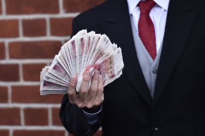 File image of man holding cash