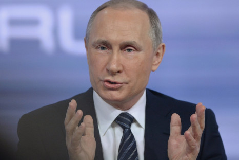 Putin takes questions from journalists during hisannual