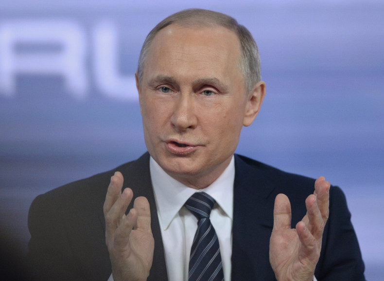 Putin takes questions from journalists during hisannual