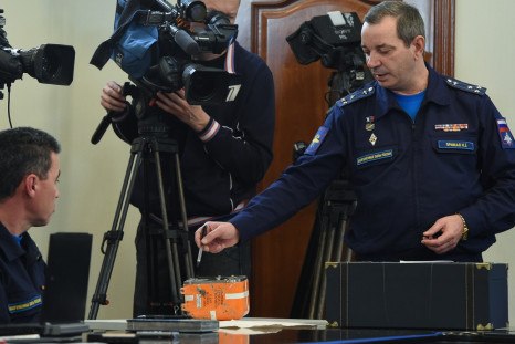 A Russian military official points to the flight recorder from the Russian Sukhoi Su-24 bomber which was shot down by a Turkish jet on November 24