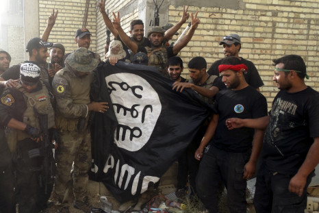 Iraqi soldiers hold ISIS flag in Ramadi