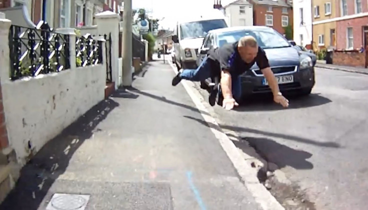 Road rage driver takes a fall. 