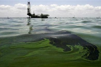 Oil spill on water is seen near an oil production facility at Maracaibo lake near the coastal town of Barranquitas