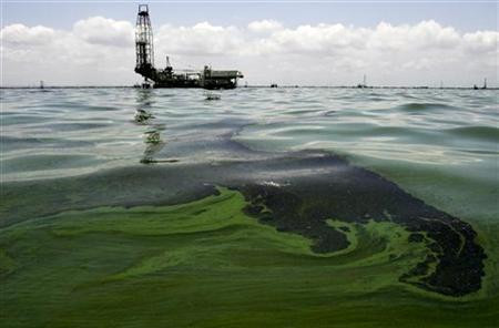Oil spill on water is seen near an oil production facility at Maracaibo lake near the coastal town of Barranquitas