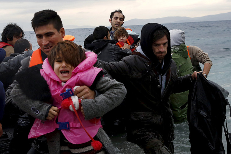 Refugees arrive on an inflattable raft on the Greek island of Lesbos