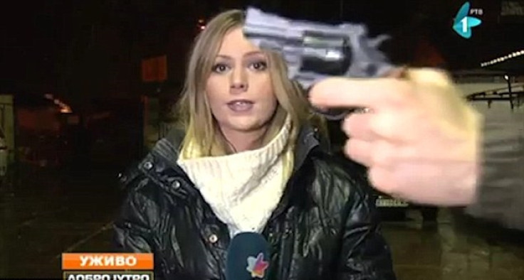 Man waves gun at reporter on liveTV
