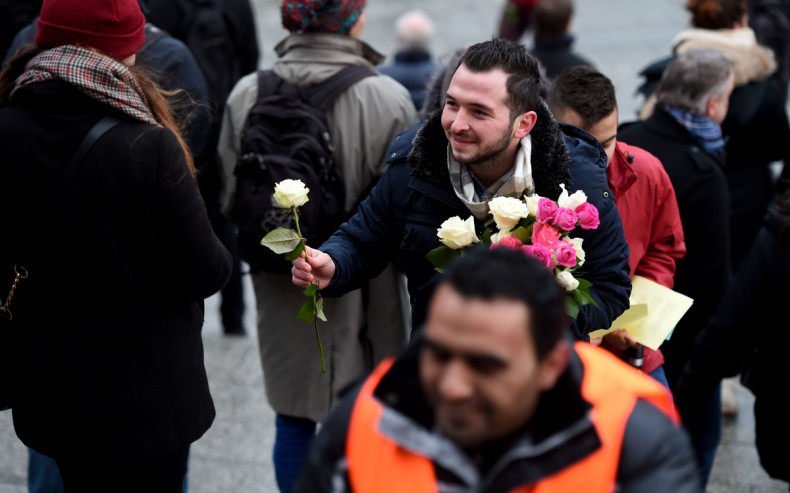 Refugee hands out flowers in Cologne