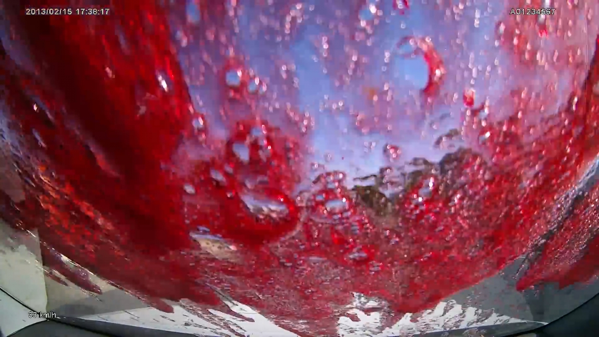 Australia Video of winebottle explosion wherein car is showered with