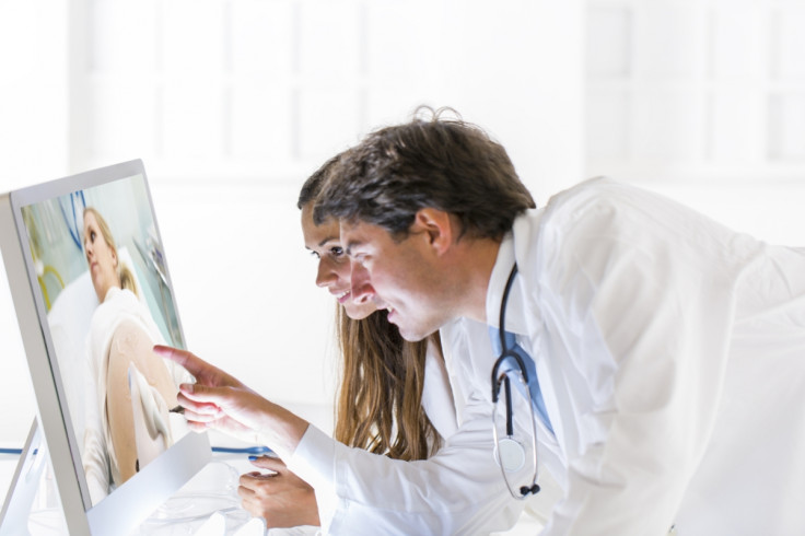 Doctors monitor patient stock photo