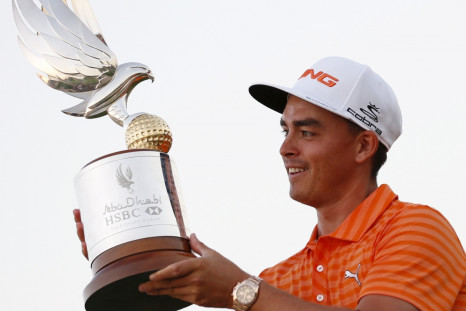 Rickie Fowler holds his trophy