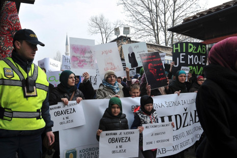 Muslim women take part in a protest