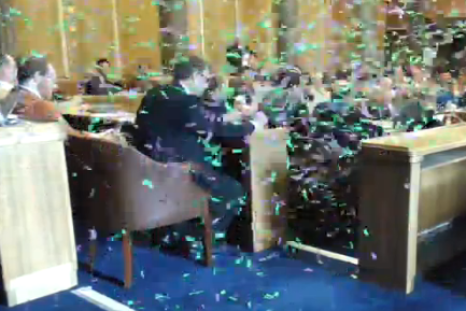 Protesters released confetti at the council meeting